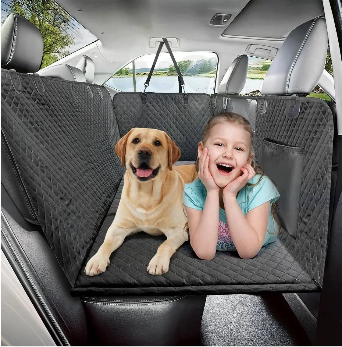 Pet House dark gray quilted dog car seat cover with hammock design, mesh window, and side flaps, featuring a Labrador and a girl.